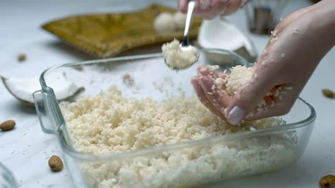 Woman's hands preparing coconut chocolate bowls in 4K Stock Footage 138257290