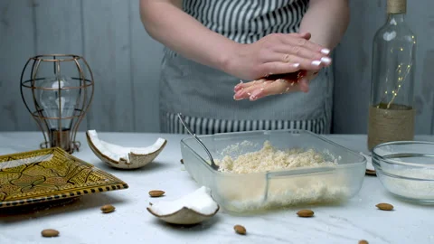 Woman's hands preparing coconut chocolate bowls in 4K Stock Footage 138257305