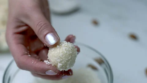 Woman's hands preparing coconut chocolate bowls in 4K Stock Footage 138258127