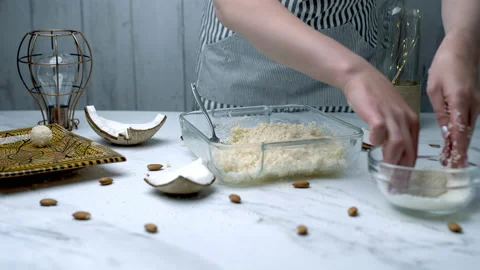 Woman's hands preparing coconut chocolate bowls in 4K Stock Footage 138258680
