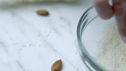 Woman's hands preparing coconut chocolate bowls in 4K Stock Footage 138258681