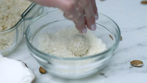 Woman's hands preparing coconut chocolate bowls in 4K Stock Footage 138260038