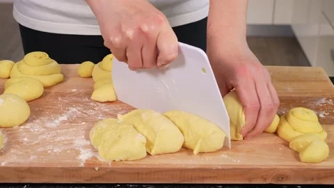 Woman's hands preparing dough for baking easter bunnies Stock Footage 169571886