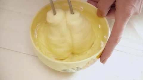 Woman's hands prepering the cream for the eclairs clsoeup Stock Footage 74477539