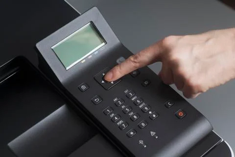 Woman's hands pressing button on Control panel laser color printer Stock-Fotos