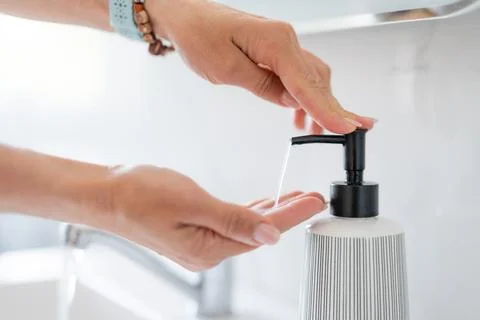 WomanS Hands Pumping Liquid Soap Stock Photos