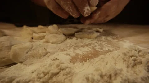 Woman`s Hands Put Sliced Piece of Paste in Flour on Board For Coking in Front Stock Footage 66441965