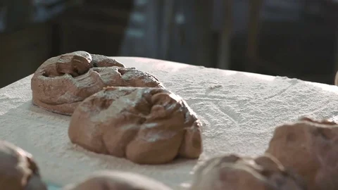 Woman's hands putting dough on table. Slowly Video stock 70682226