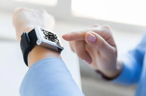 Woman's hands with qr code on smart watch 스톡 사진