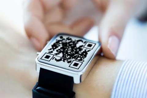 Woman's hands with qr code on smart watch 库存照片