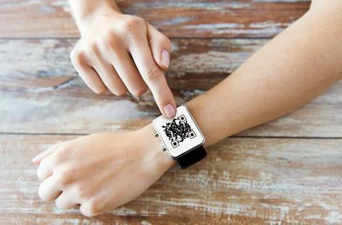 Woman's hands with qr code on smart watch 库存照片