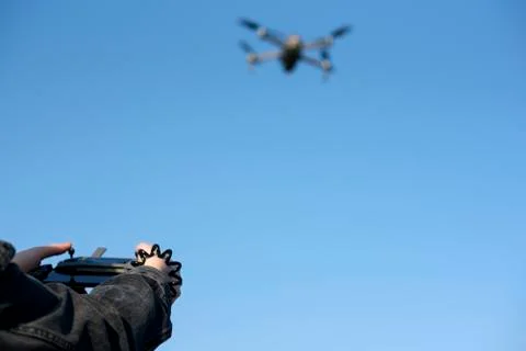 Woman's hands on remote controller that controls the drone. Drone flight Stock Photos