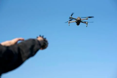 Woman's hands on remote controller that controls the drone. Drone flight Stock Photos