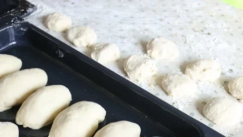Womans hands rolling the dough for pies. Baking at home Video stock 182028039