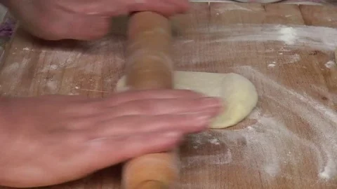 Woman’s hands rolling dough with a pin in bakery 스톡 동영상 82310913