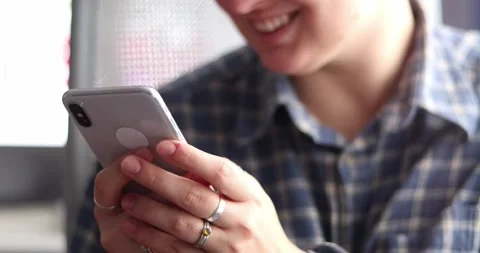 Woman's hands scroll mobile phone keypad to check messages, texting, correspo Stock Footage 301445774