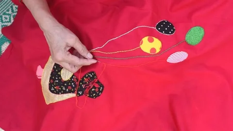 Woman's hands sewing applique work Stock Footage 220869179