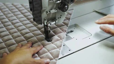 Woman's hands sewing fabric on the automatic sewing machine. Close-up seamstress Stock Footage 233089896