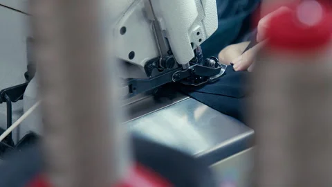 Woman's Hands Sewing Fabric On The Automatic Sewing Machine. Close-Up Seamstress Stock Footage 254373181