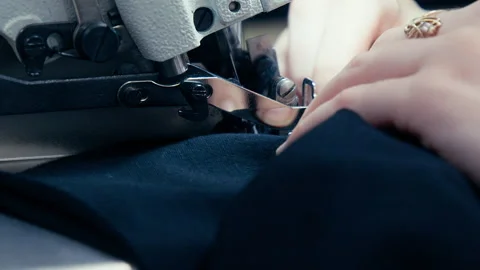 Woman's Hands Sewing Fabric On The Automatic Sewing Machine. Close-Up Seamstress Stock Footage 254373207