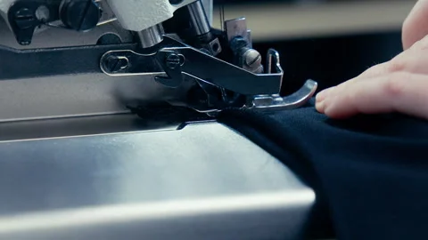 Woman's Hands Sewing Fabric On The Automatic Sewing Machine. Close-Up Seamstress Stock Footage 254373231