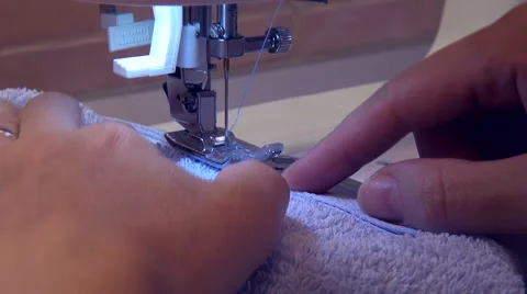 Woman's hands, sewing machine, working, repair fabric Stock Footage 46426571