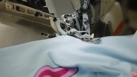 Woman's hands sewing an overlock at sewing machine. Overlock stitch on sewing Video stock 97156894