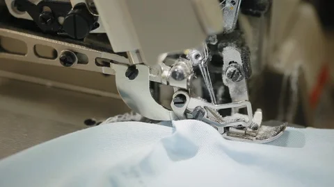 Woman's hands sewing an overlock at sewing machine. Overlock stitch on sewing Video stock 97156991