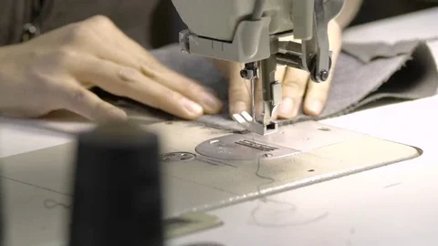 Woman's hands sewing on sewing machine Video stock 69144949