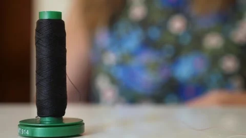 Woman's Hands Sewing on White Table with Close-up of Thread Stock Footage 293344343