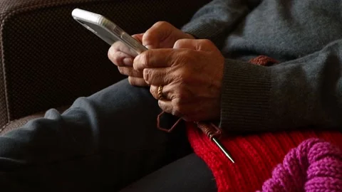 Woman's hands as she scrolls through phone Stock Footage 171504363