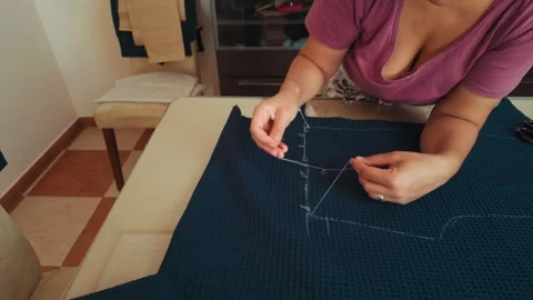 Woman's Hands Skillfully Sewing Blue Fabric with Needle and Thread at Home Stock Footage 346410146