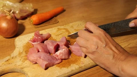 Woman's hands slicing raw pork meat 스톡 동영상 342805832