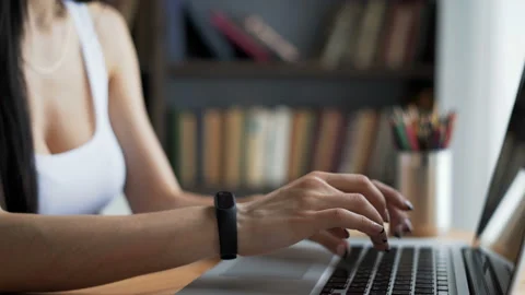 Woman's hands with smartwatch close up write at desktop in workplace. Young pers Video stock 199491557