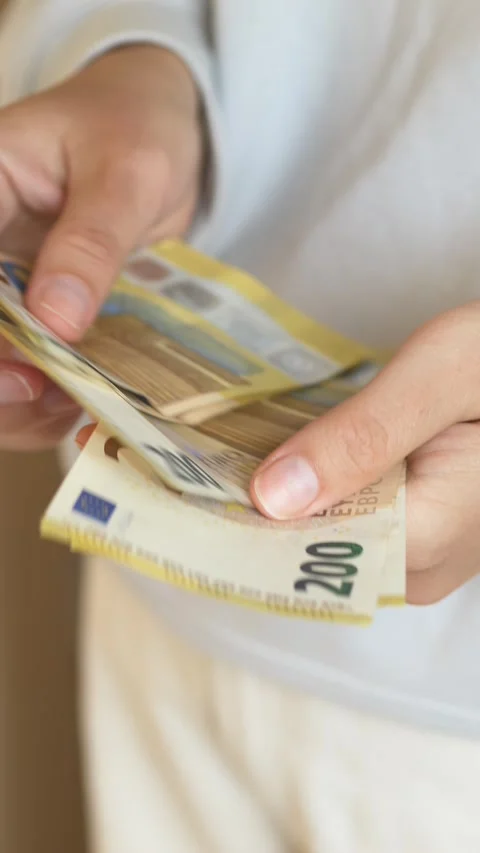 Womans hands sorting euro bills, illustrating financial growth, wealth Stock Footage 332904407