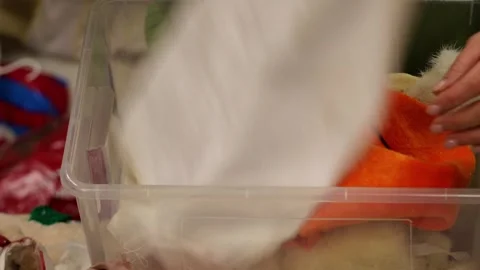 Woman’s hands sorting fabric pieces and cleaning a creative studio workspace, pr Stock Footage 326505078