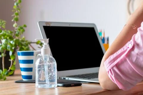 Woman's hands Tablet at home, with a computer during the coronavirus quaranti Stock Photos
