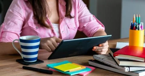 Woman's hands Tablet at home, with a computer during the coronavirus quaranti Stock Photos
