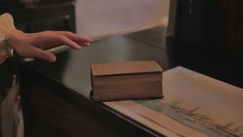 Woman's hands take a small elegant book. Stock Footage 149666707