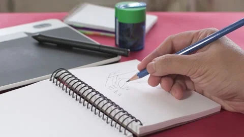Woman's hands taking notes with a pencil in a notebook Stock Footage 136929846