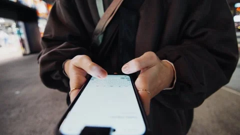 Womans hands texting message on smartphone at night Stock Footage 321258366