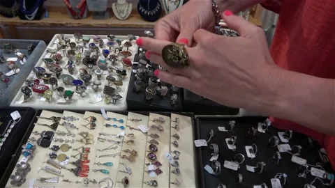 Womans hands trying a ring in the silver shop Stock Footage 166598578