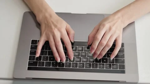 Womans hands typing on laptop keyboard. Work AI prompt Research Social networks Stock Footage 323213238
