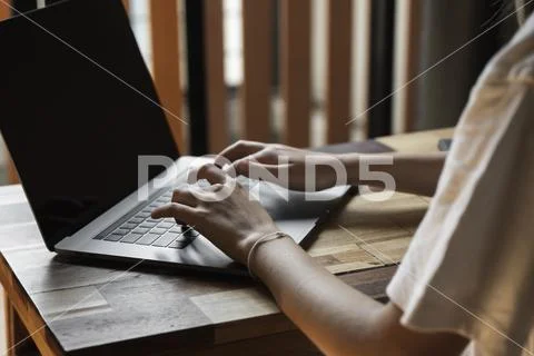 Woman's hands typing on laptop keyboard. Study and work online, freelance. Self Stock Photos