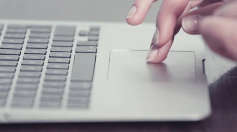 Woman's hands using and clicking in a trackpad from a portable computer Stock-Footage 48160442