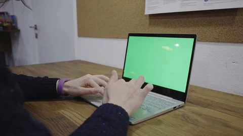 Woman's hands using laptop with green screen Stock Footage 75817642