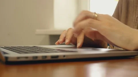 Woman's hands using laptop, searching web, browsing information of travel Stock Footage 169519775