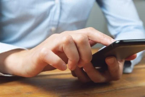 Woman's hands using mobile smartphone. Woman texting, doing business Stock Photos