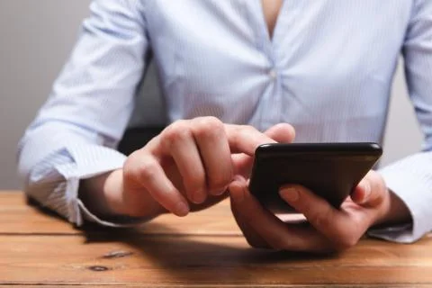 Woman's hands using mobile smartphone. Woman texting, doing business Stock Photos