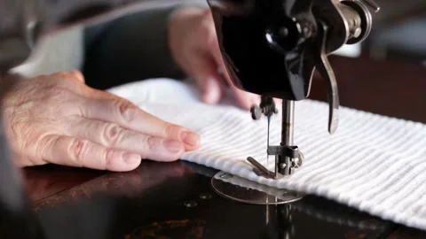 Woman's hands using an old sewing machine Stock Footage 144291105